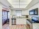Modern kitchen featuring stainless steel appliances, white cabinets, and a breakfast bar at 1100 East Bay Dr # 42, Largo, FL 33770