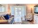 Inviting living room with beach themed decor, comfortable seating, and natural light at 1100 East Bay Dr # 42, Largo, FL 33770