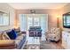 Relaxing living room features comfortable seating, beachy decor, and a serene atmosphere at 1100 East Bay Dr # 42, Largo, FL 33770