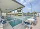 Shuffleboard court in community area with shade, chairs, and tables, perfect for outdoor recreation at 1100 East Bay Dr # 42, Largo, FL 33770