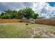 Spacious backyard with a swing and wooden fence at 11104 Taft Dr, Port Richey, FL 34668