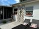 Outdoor shower and lounge area featuring a decorative tile panel at 11104 Taft Dr, Port Richey, FL 34668