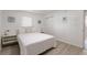 Well-lit bedroom featuring a comfortable bed, matching side tables, and a spacious closet at 11104 Taft Dr, Port Richey, FL 34668