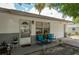 Charming home exterior with a cozy front porch and well-maintained landscaping at 11104 Taft Dr, Port Richey, FL 34668