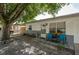 Inviting front porch with blue chairs and well-maintained landscaping at 11104 Taft Dr, Port Richey, FL 34668