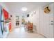 Charming kitchen with vibrant red cabinets and access to outdoor patio at 11104 Taft Dr, Port Richey, FL 34668