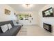 Cozy living room featuring tile floors, bright walls, and plenty of natural light at 11104 Taft Dr, Port Richey, FL 34668