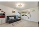 Inviting living room with tile floors, bright walls, and a view of the front yard at 11104 Taft Dr, Port Richey, FL 34668