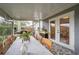 This patio features a dining area, outdoor access, and tile floors at 11104 Taft Dr, Port Richey, FL 34668
