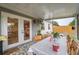 Enclosed patio with a long dining table, stylish tile flooring, and a relaxing outdoor ambiance at 11104 Taft Dr, Port Richey, FL 34668