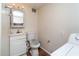 Full bathroom featuring a sink, toilet, and washing machine at 1142 7Th Nw St, Largo, FL 33770