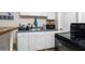 Efficient kitchen with ample counter space, essential appliances, and practical storage solutions at 1142 7Th Nw St, Largo, FL 33770