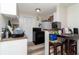 Cozy kitchen with a black range stove, white refrigerator, and breakfast nook with seating at 1142 7Th Nw St, Largo, FL 33770