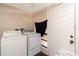 Laundry room with washer, dryer, and exterior access at 1142 7Th Nw St, Largo, FL 33770