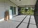 Spacious screened porch, ideal for enjoying the outdoors while staying protected from the elements at 11729 John Robbins Rd, Riverview, FL 33578