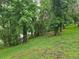 The backyard of this property offers serene water views with lush foliage at 11802 Raintree Lake Ln # B, Temple Terrace, FL 33617