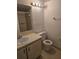 Bathroom featuring a vanity, toilet, and shower/tub combo with neutral tile at 11802 Raintree Lake Ln # B, Temple Terrace, FL 33617