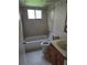 The bathroom features tiled floor and walls, a bath tub and vanity sink at 11802 Raintree Lake Ln # B, Temple Terrace, FL 33617