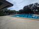 Expansive community pool area with swimming lanes and abundant deck space for lounging and recreation at 11802 Raintree Lake Ln # B, Temple Terrace, FL 33617