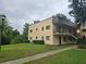 Inviting two-story condo building featuring well-maintained landscaping and convenient stairway access to upper levels at 11802 Raintree Lake Ln # B, Temple Terrace, FL 33617