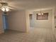 Bright, open living space with tile floors and window blinds at 11802 Raintree Lake Ln # B, Temple Terrace, FL 33617