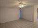 Spacious living room with tile flooring and a ceiling fan for comfortable living at 11802 Raintree Lake Ln # B, Temple Terrace, FL 33617