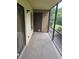 Enclosed patio area with screen and door, ideal for outdoor relaxation at 11802 Raintree Lake Ln # B, Temple Terrace, FL 33617