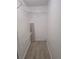 Walk-in closet with wire shelving and laminate flooring, offering ample storage space at 11802 Raintree Lake Ln # B, Temple Terrace, FL 33617