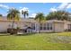 Spacious backyard featuring a hot tub, grill area, and covered patio, ideal for entertaining at 1226 Hermitage Ave, Clearwater, FL 33764