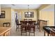 Cozy dining room featuring tile floors, modern light fixture, and neutral wall color at 1226 Hermitage Ave, Clearwater, FL 33764