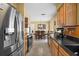 Modern kitchen featuring stainless steel appliances, wooden cabinets, and tile flooring at 1226 Hermitage Ave, Clearwater, FL 33764