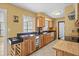 Well-equipped kitchen featuring wooden cabinets, modern appliances, and a bright window at 1226 Hermitage Ave, Clearwater, FL 33764