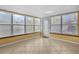 Bright sun room with neutral tile flooring and multiple large windows that offer outdoor views at 1226 Hermitage Ave, Clearwater, FL 33764