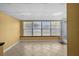 Bright sun room featuring tile floors, yellow walls, and many windows to enjoy outdoor views at 1226 Hermitage Ave, Clearwater, FL 33764