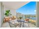 Relaxing balcony featuring modern furniture and beautiful water views at 1325 Snell Isle Ne Blvd # 810, St Petersburg, FL 33704