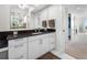 Modern bathroom featuring a sleek vanity with dark countertop and ample storage at 1325 Snell Isle Ne Blvd # 810, St Petersburg, FL 33704