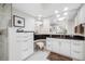 Elegant bathroom with white cabinets, black countertops, and a vanity area offering a luxurious feel at 1325 Snell Isle Ne Blvd # 810, St Petersburg, FL 33704