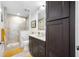 Cozy bathroom with a glass-enclosed shower and dark wood vanity at 1325 Snell Isle Ne Blvd # 810, St Petersburg, FL 33704