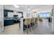 Open-concept kitchen featuring a breakfast bar with seating and views into the living room and ocean at 1325 Snell Isle Ne Blvd # 810, St Petersburg, FL 33704