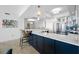 Modern kitchen with a large island, white marble countertops, and stainless steel appliances at 1325 Snell Isle Ne Blvd # 810, St Petersburg, FL 33704