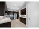 Spacious kitchen featuring dark wood cabinetry, stainless steel appliances, and ample counter space at 1325 Snell Isle Ne Blvd # 810, St Petersburg, FL 33704