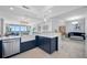 Open-concept kitchen with water views, stainless steel appliances, and an adjacent living area at 1325 Snell Isle Ne Blvd # 810, St Petersburg, FL 33704
