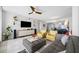 Spacious living room featuring sleek TV console and comfortable seating arrangement at 1325 Snell Isle Ne Blvd # 810, St Petersburg, FL 33704