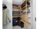 Organized walk-in closet featuring wooden shelving and ample storage space at 1325 Snell Isle Ne Blvd # 810, St Petersburg, FL 33704
