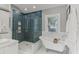 Beautiful bathroom with a modern shower, a clawfoot tub, and elegant fixtures at 1402 E Powhatan Ave, Tampa, FL 33604