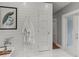 This bathroom features shiplap walls, a white door, and a framed peacock print at 1402 E Powhatan Ave, Tampa, FL 33604