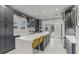 Modern kitchen with stainless steel appliances, large island, and stylish cabinetry at 1402 E Powhatan Ave, Tampa, FL 33604