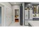 Bright kitchen featuring stainless steel appliances, white subway tile flooring, and a convenient built-in wine rack at 1402 E Powhatan Ave, Tampa, FL 33604