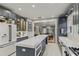 Stylish kitchen with a large island, stainless steel appliances, and an open layout connecting to the dining area at 1402 E Powhatan Ave, Tampa, FL 33604