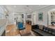 Spacious living room featuring hardwood floors, stylish furniture, and open layout at 1402 E Powhatan Ave, Tampa, FL 33604